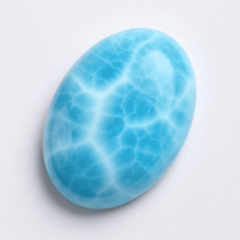 楕円形のラリマー（Larimar）カボション。淡いブルーと白のマーブル模様が美しく輝く天然石。
